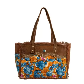 Myra Bag Blue Ridge Blossoms Crossbody: Vibrant Woven Rug, Hand-Tooled Leather, and Frayed Edge Accents